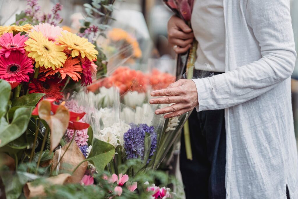 A lady buying flower from a floweriest