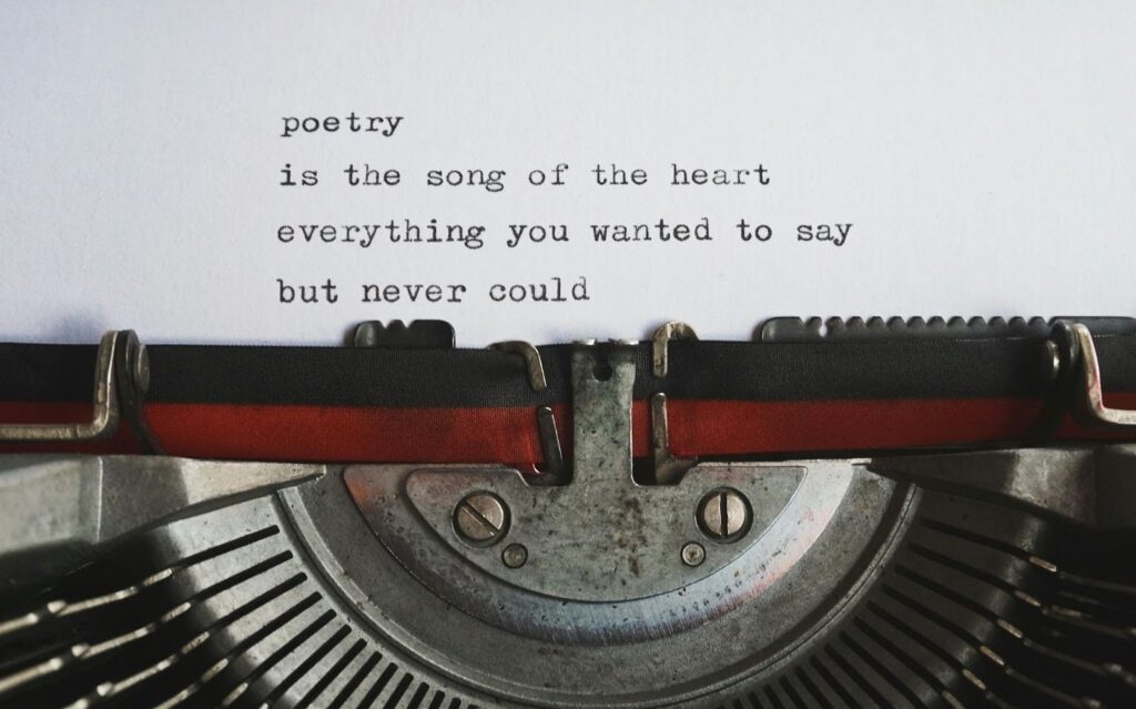 Poetry tying on old typrwriter